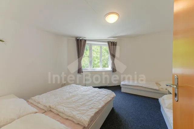 Ložnice v apartmá pro 4 osoby